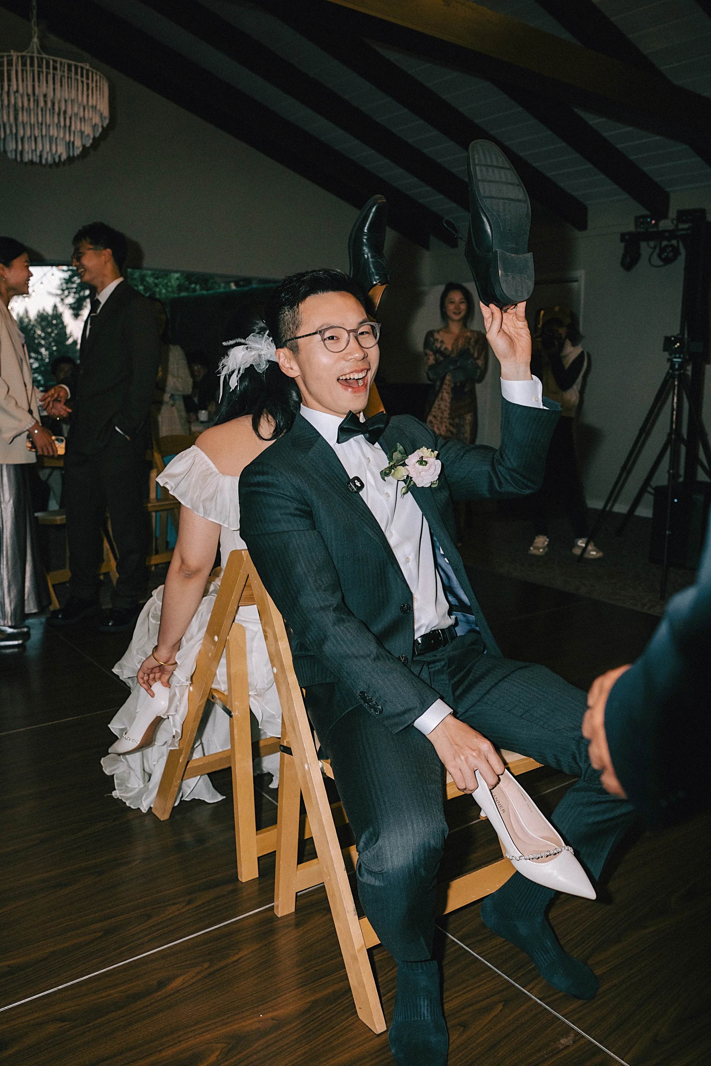 Groom lifted on a chair during the reception celebration
